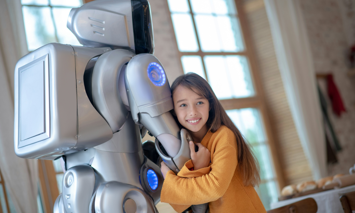 A child hugging a robot